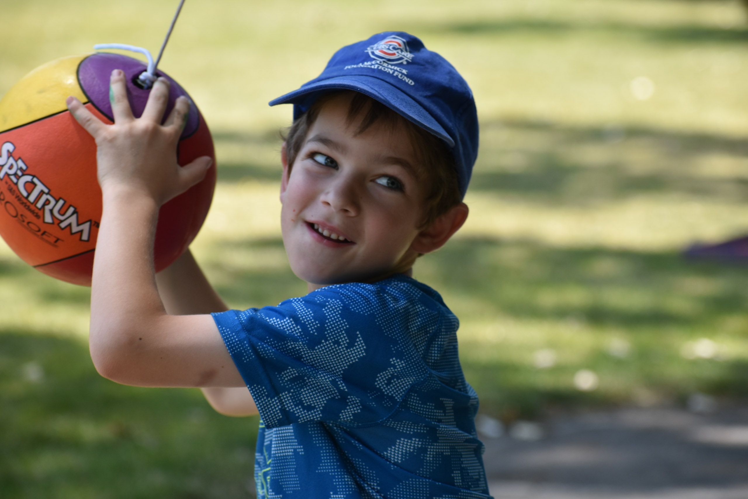 A camper holding a ball.