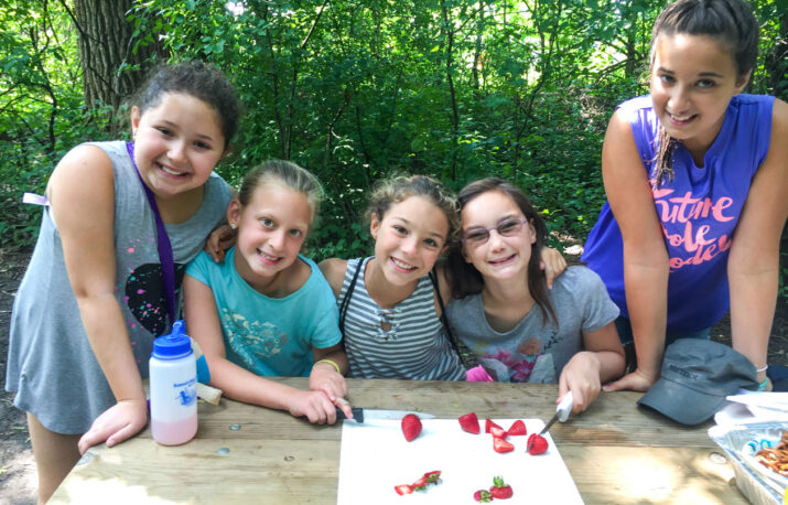 A group of young counselors working together.