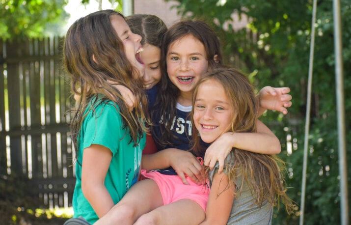 Girls laughing and playing.