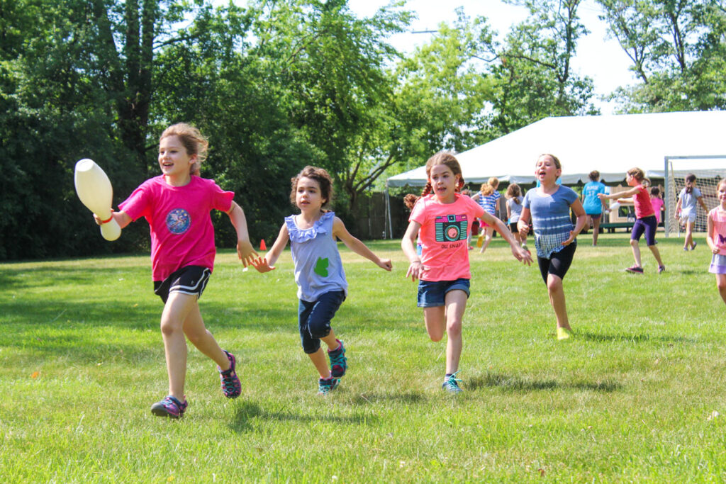 Girls runnning outside.