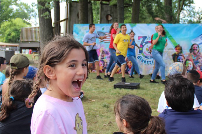 A young camper smiling.