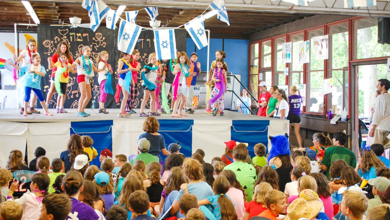 A celebration outside a camp.