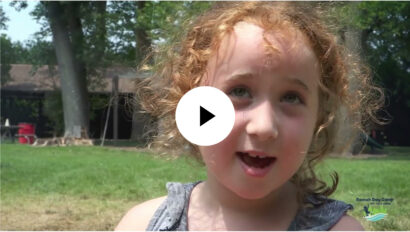 A girl with red hair talking.