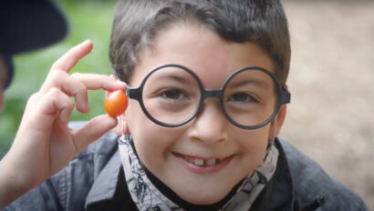 A boy wearing glasses.